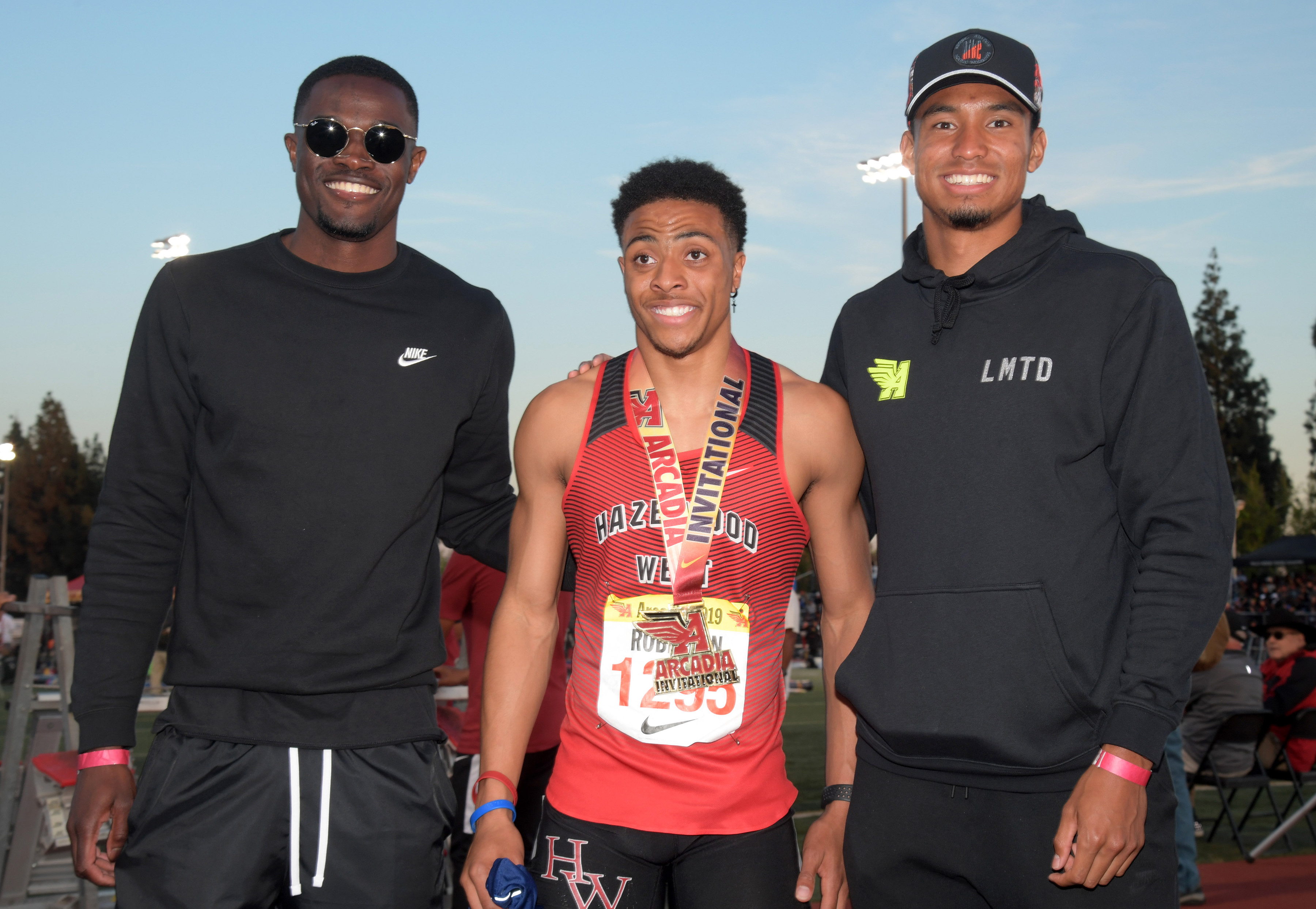 Robinson alongside Rai Benjamin (left) and Michael Norman (right) at the Arcadia Invitational in 2018; Kirby Lee/USA Today Sports